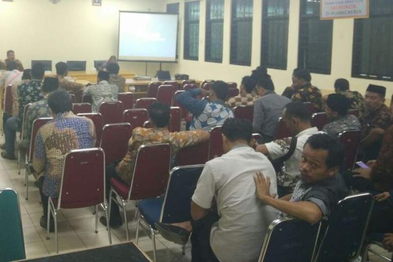 Rapat rekonsiliasi dana desa, di aula gedung DPMPD Kabupaten Tangerang.
